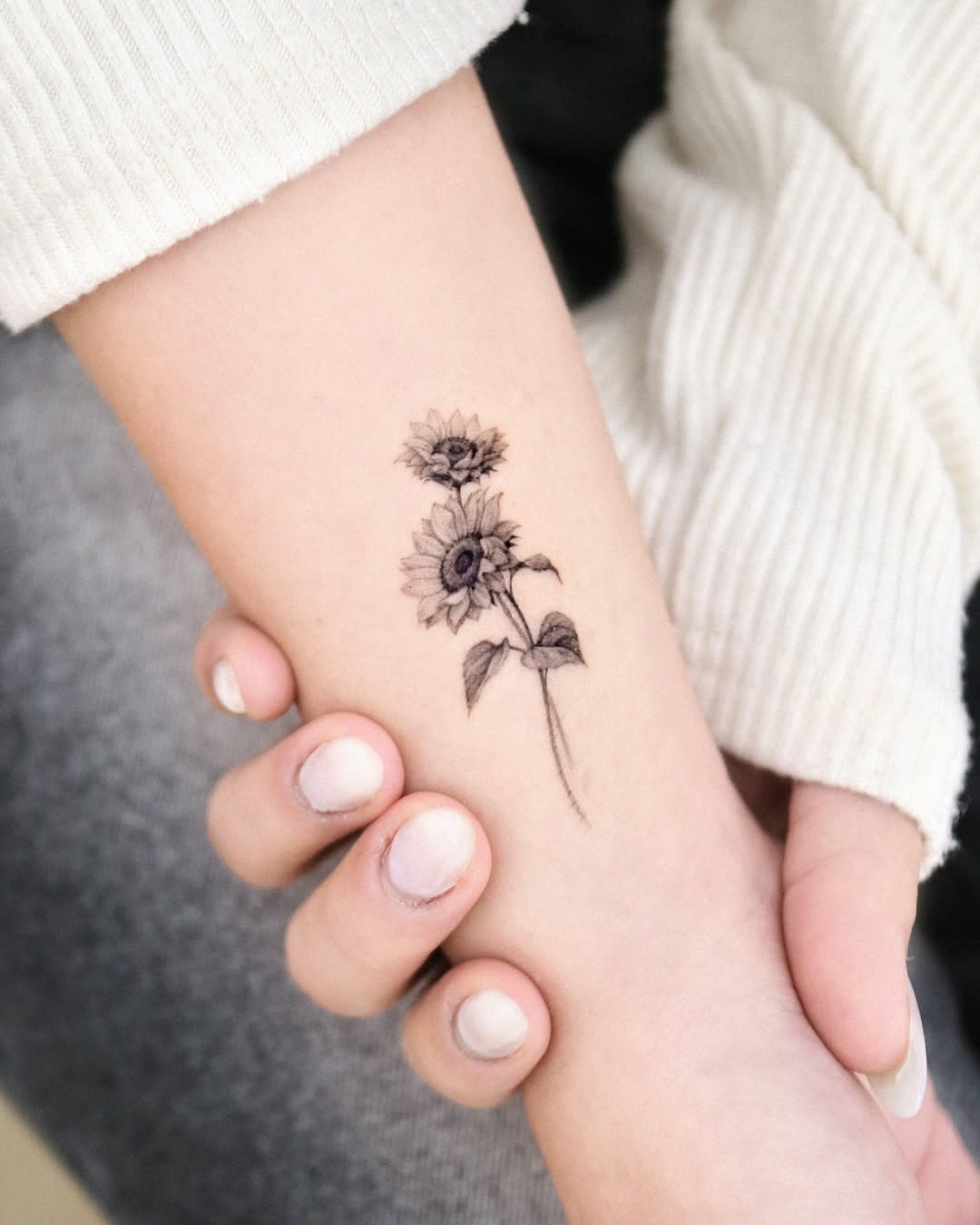 Charming minimalistic sunflower tattoos for arm