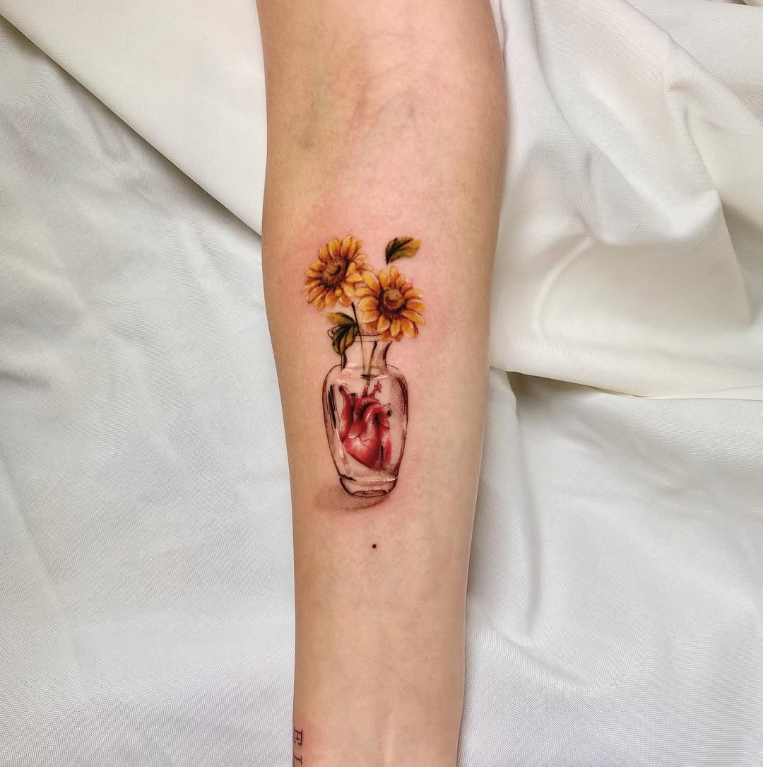 Stunning sunflower tattoo in a glass vase