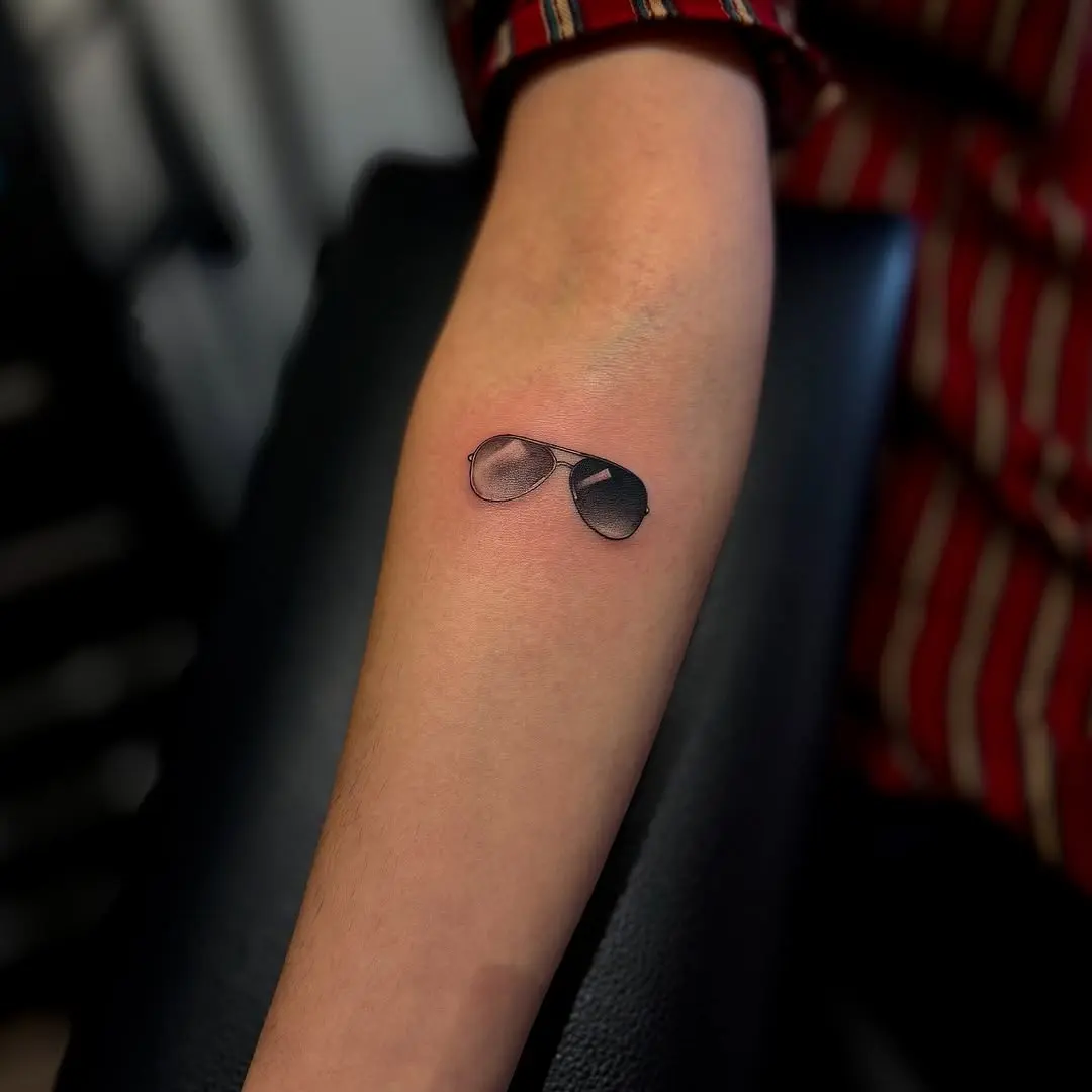 Chic small sunglasses tattoo for confident women
