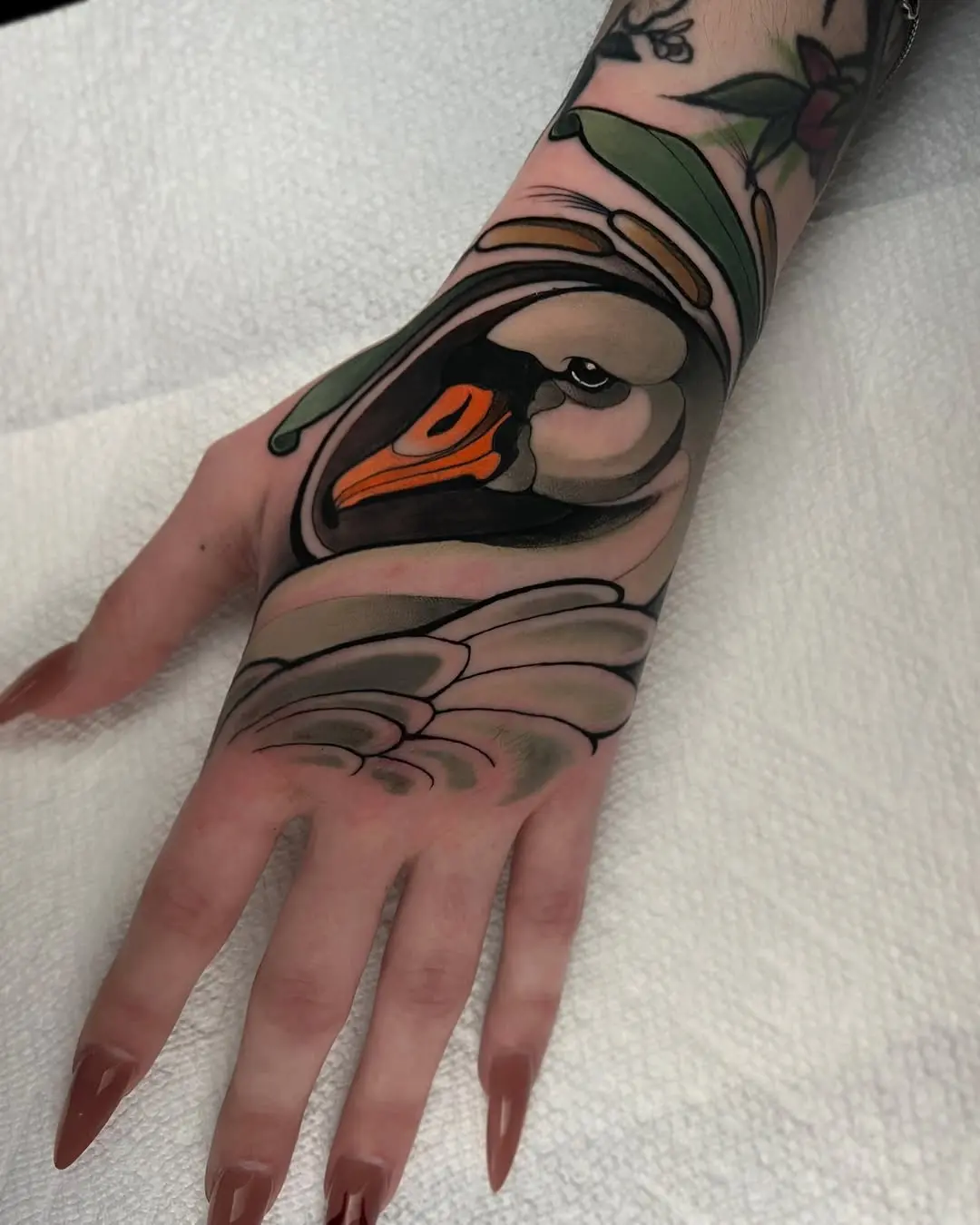 Dynamic swan tattoo showcasing elegance and grace