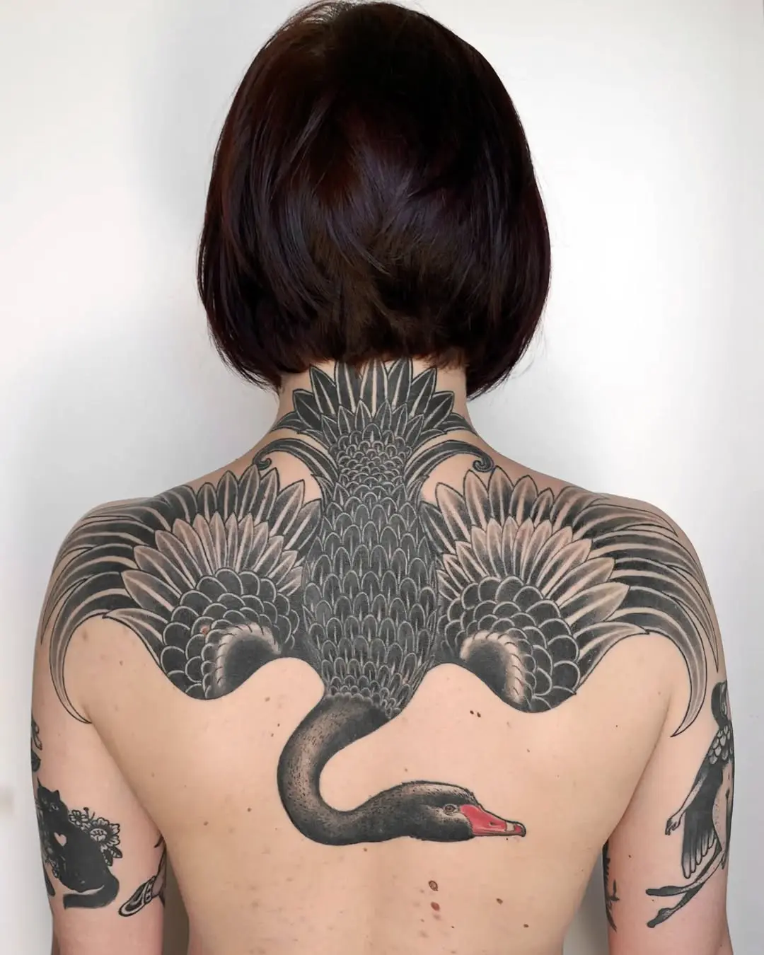 Elegant black and grey swan tattoo back piece