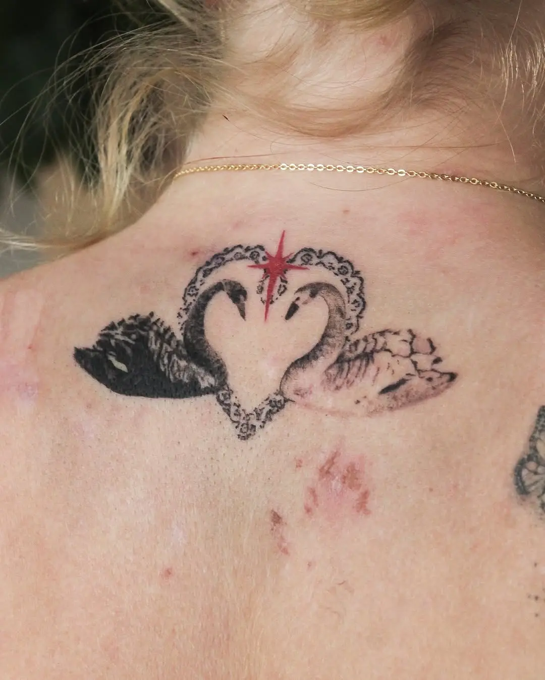 Elegant swan design with a heart motif.