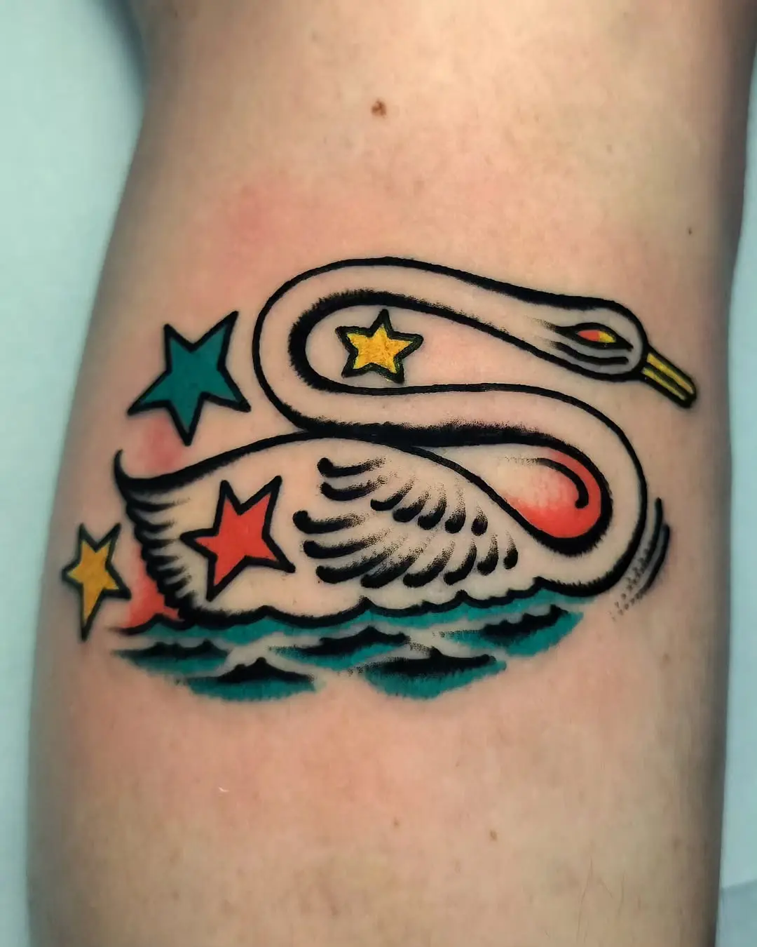 Whimsical swan tattoo with vibrant colors