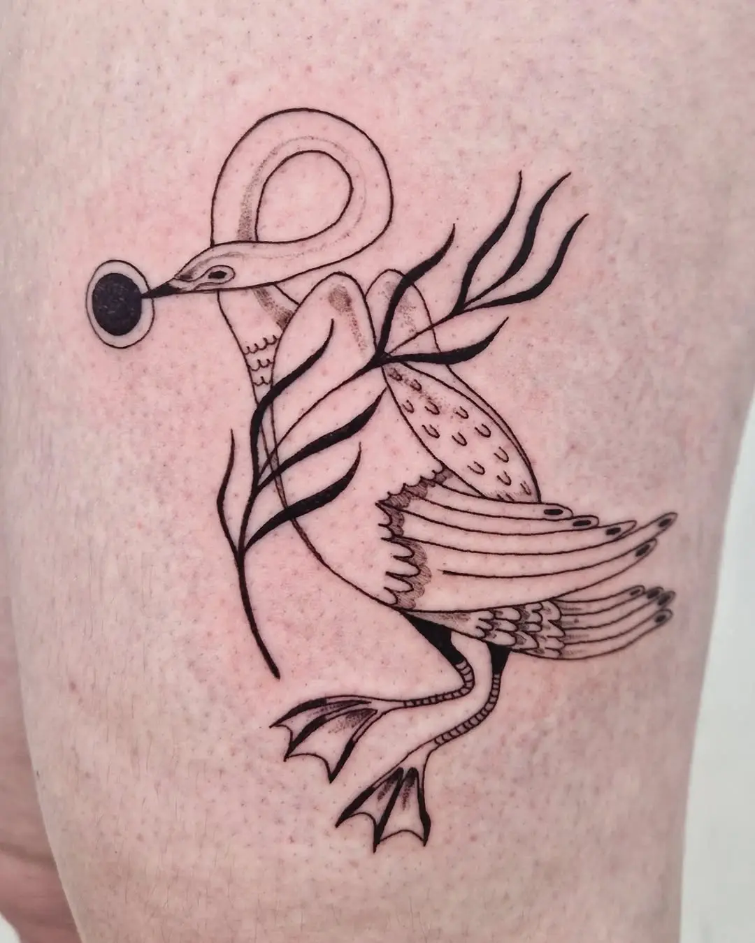 Elegant minimalist swan tattoo design with foliage
