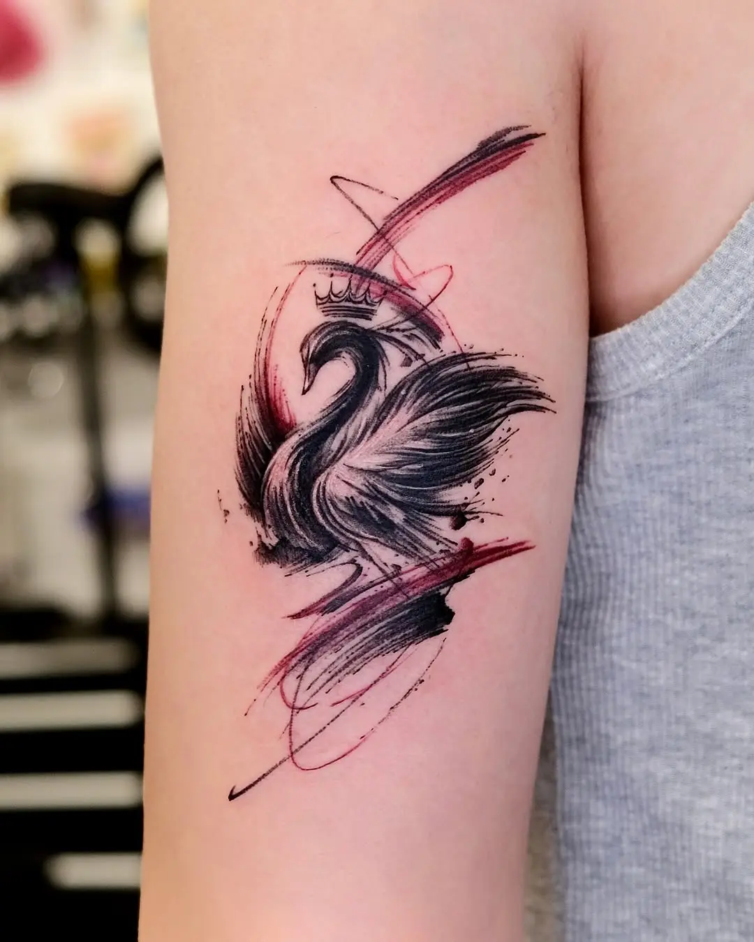 Elegant swan tattoo featuring bold brush strokes