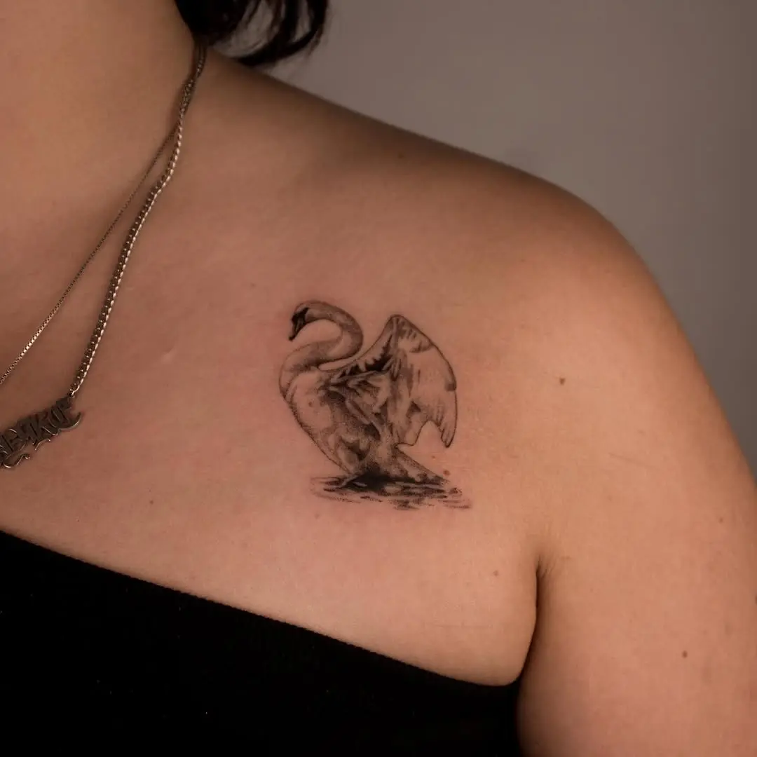 Elegant swan tattoo on shoulder area