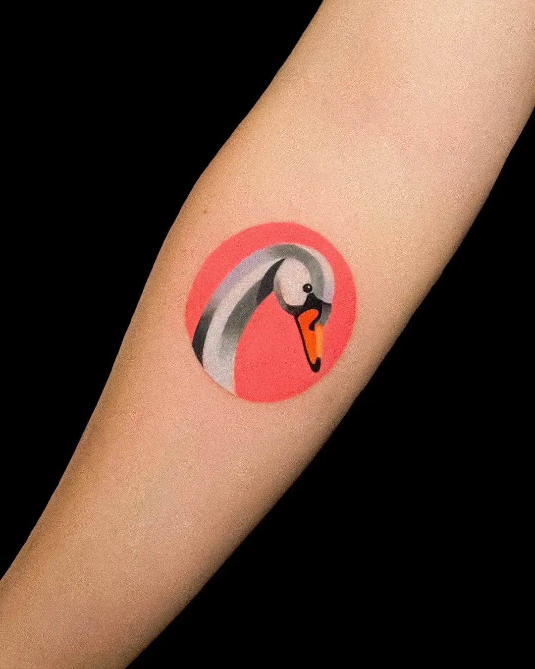 Vibrant swan tattoo with a modern touch