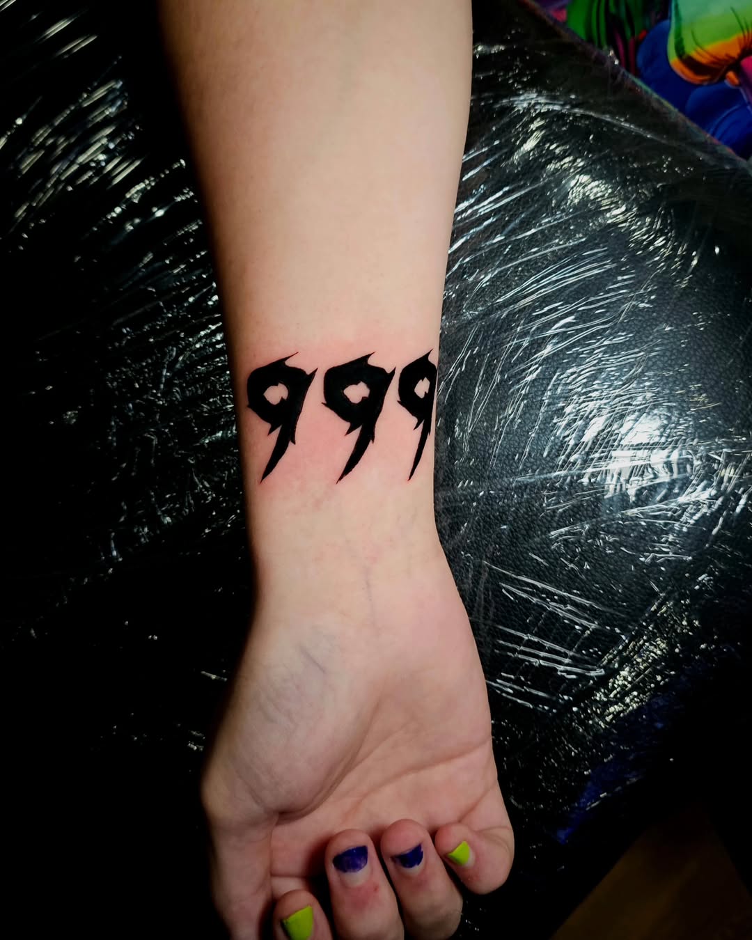 Stylish 999 Angel Number Tattoo on Forearm