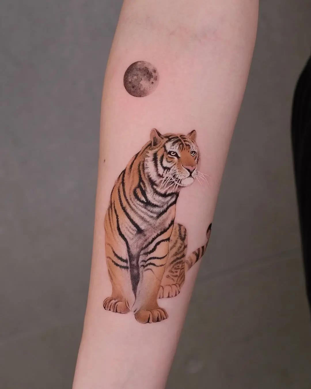 Majestic tiger tattoo with a moon motif
