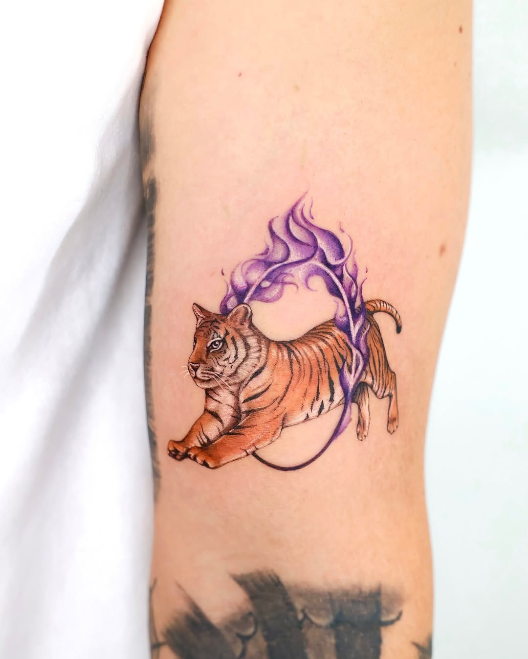 Vibrant Tiger Tattoo with Purple Flames