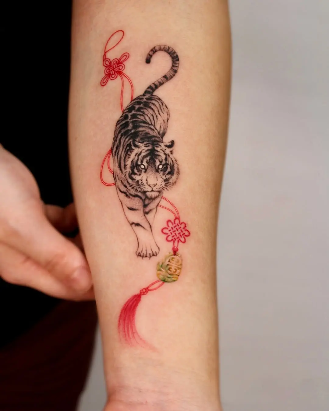Intricate black and red tiger tattoo design