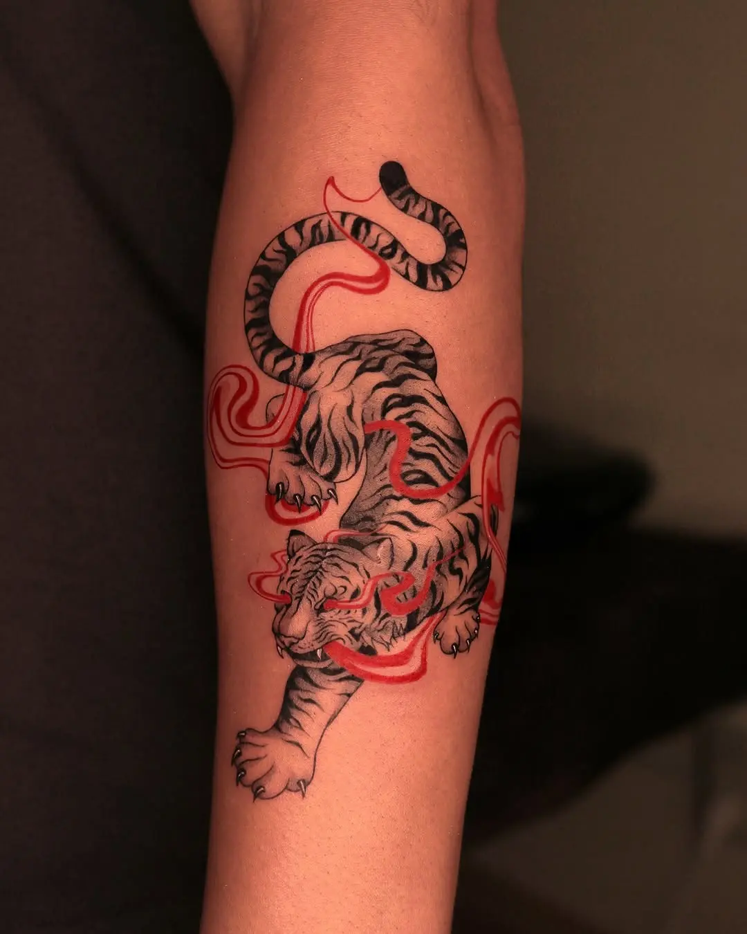 Vibrant tiger tattoo with flowing design elements