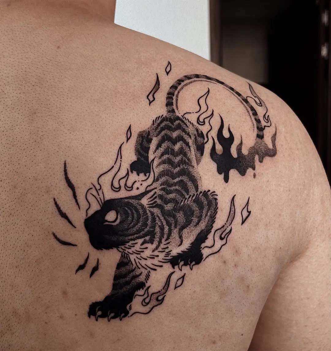 Dynamic tiger tattoo with fiery design elements