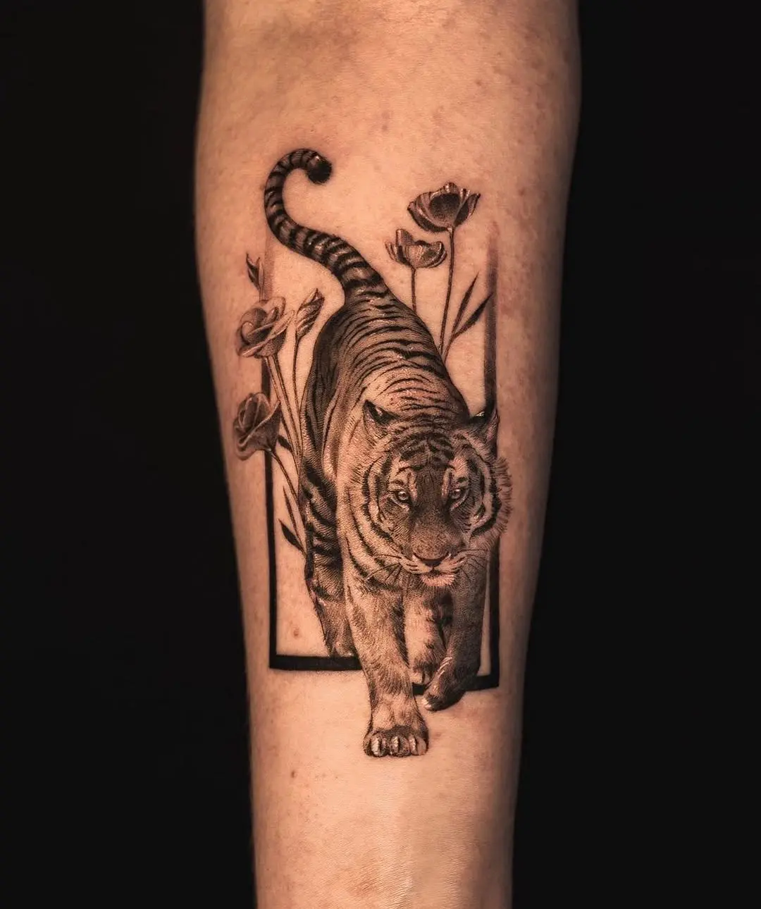 Stunning realistic tiger tattoo with flowers