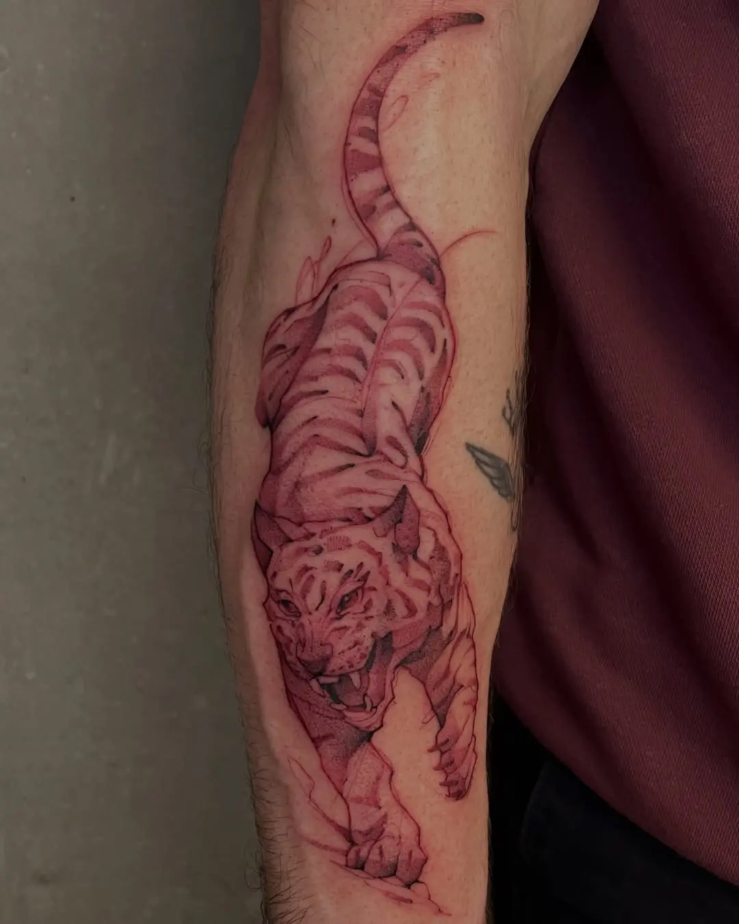 Vivid tiger tattoo showcasing intricate red ink