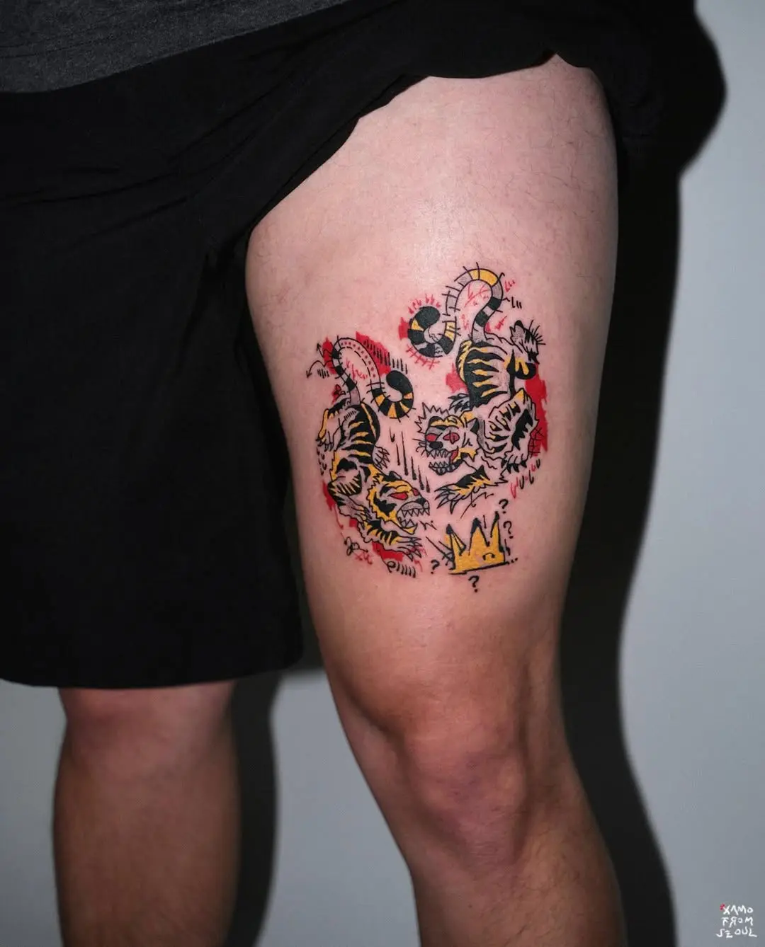 Vibrant tiger tattoos with playful elements
