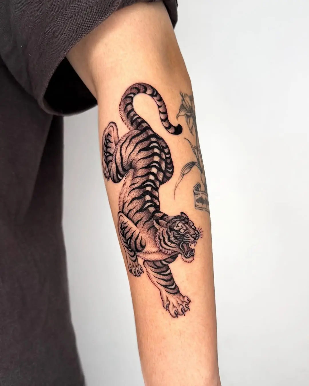 Dynamic tiger tattoo showcasing fierce details
