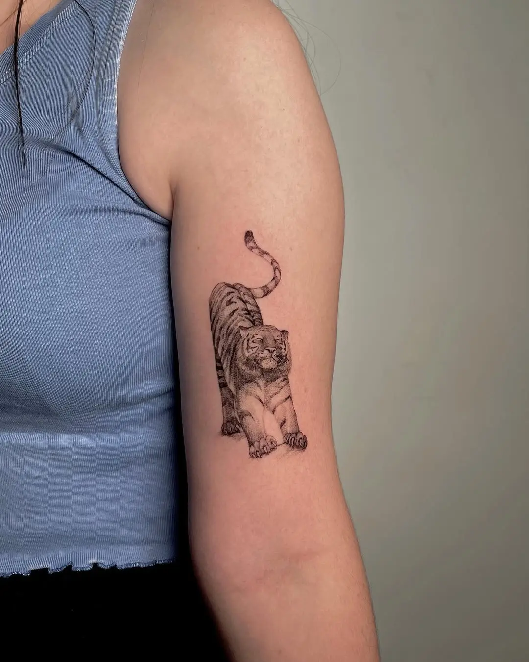Dynamic tiger tattoo embodies strength and grace