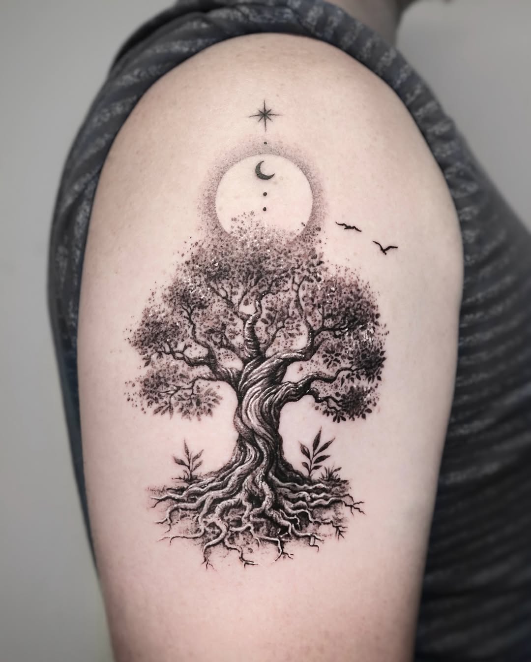 Intricate tree of life tattoo with celestial elements