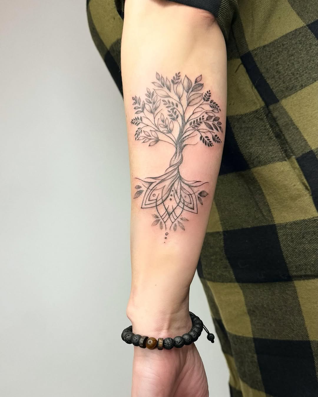 Elegant tree of life tattoo on forearm