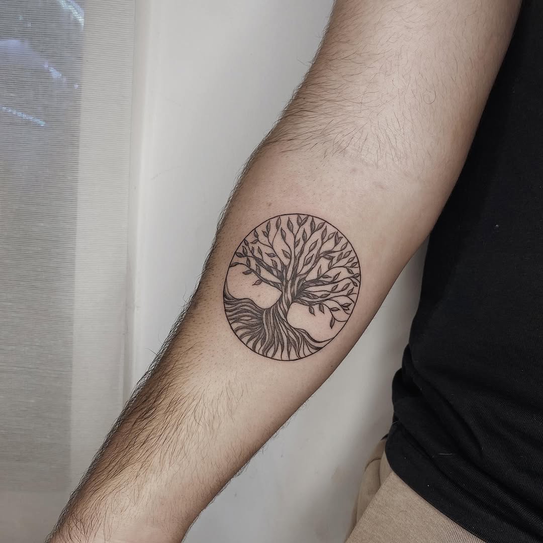 Elegant circular tree of life tattoo design