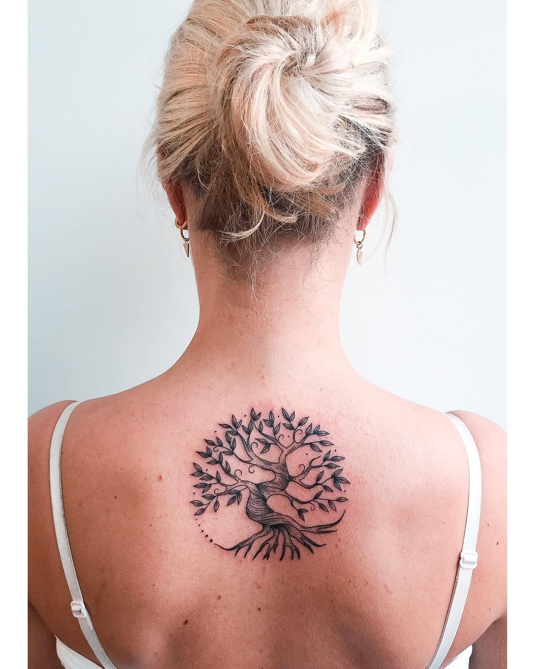 Elegant tree of life tattoo on the back