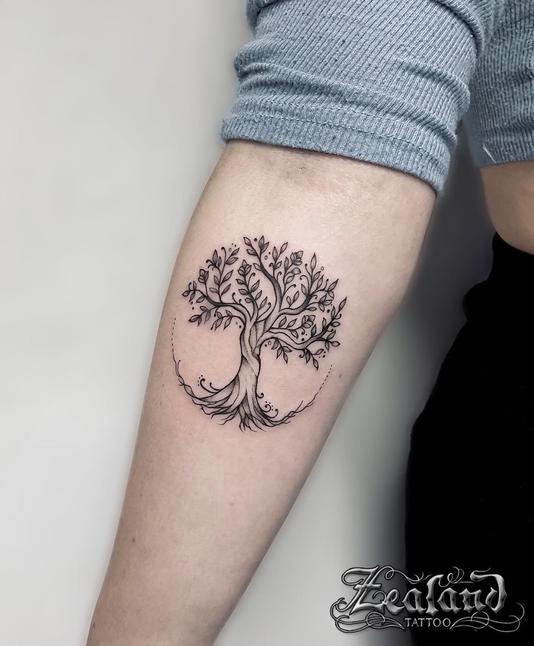 Elegant tree of life tattoo showcases intricacy and beauty