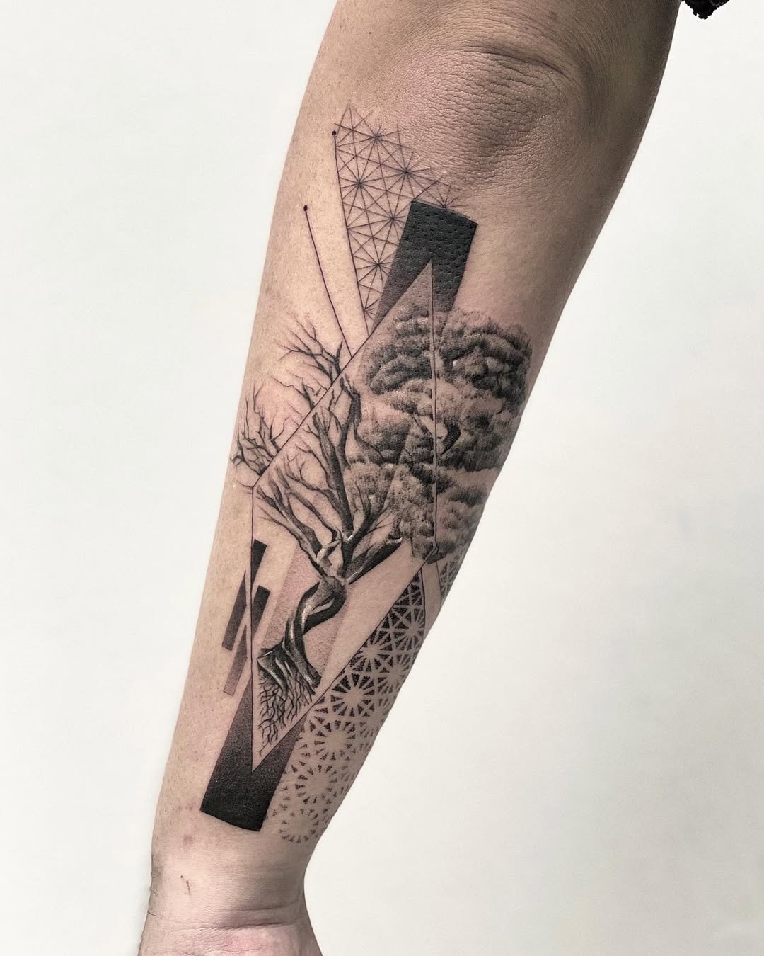 Intricate tree of life tattoo with geometric elements