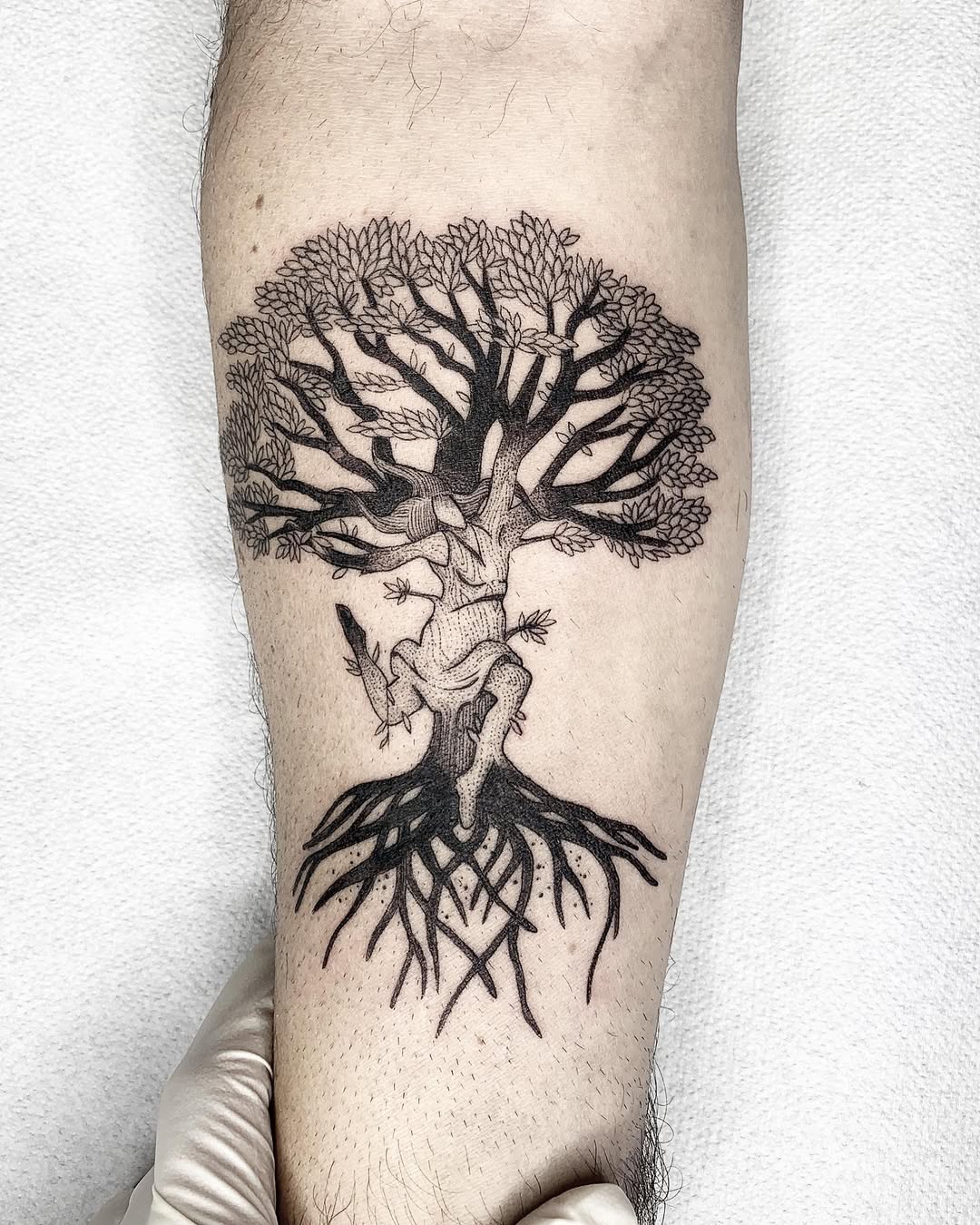 Intricate tree of life tattoo on forearm