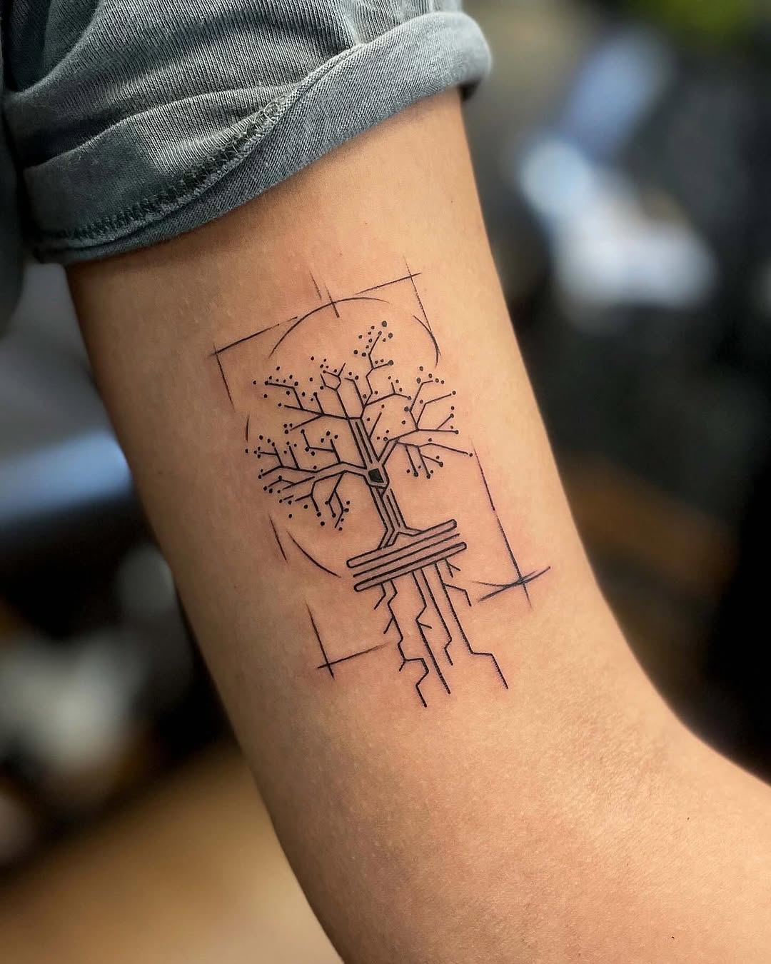 Elegant minimalist tree of life tattoo design