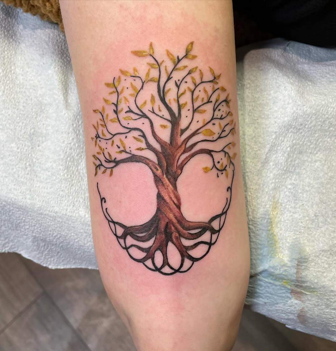 Symbolic tree tattoo with intricate roots design