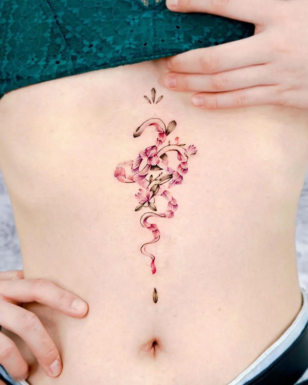 Stunning floral underboob tattoo design