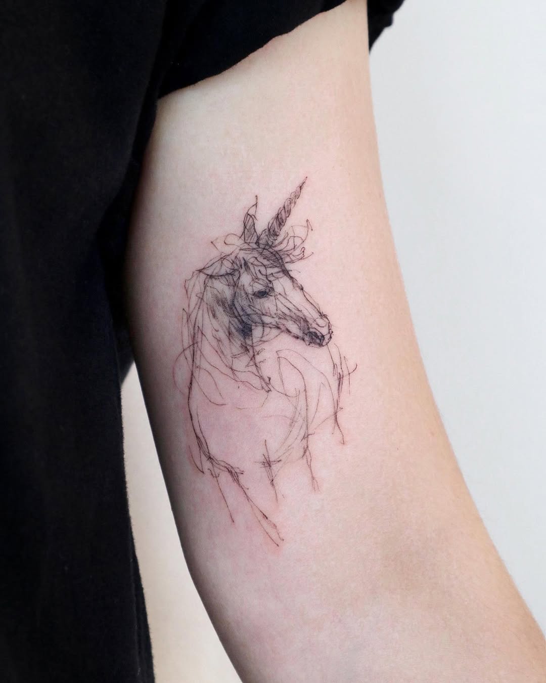 Elegant unicorn ink with delicate linework