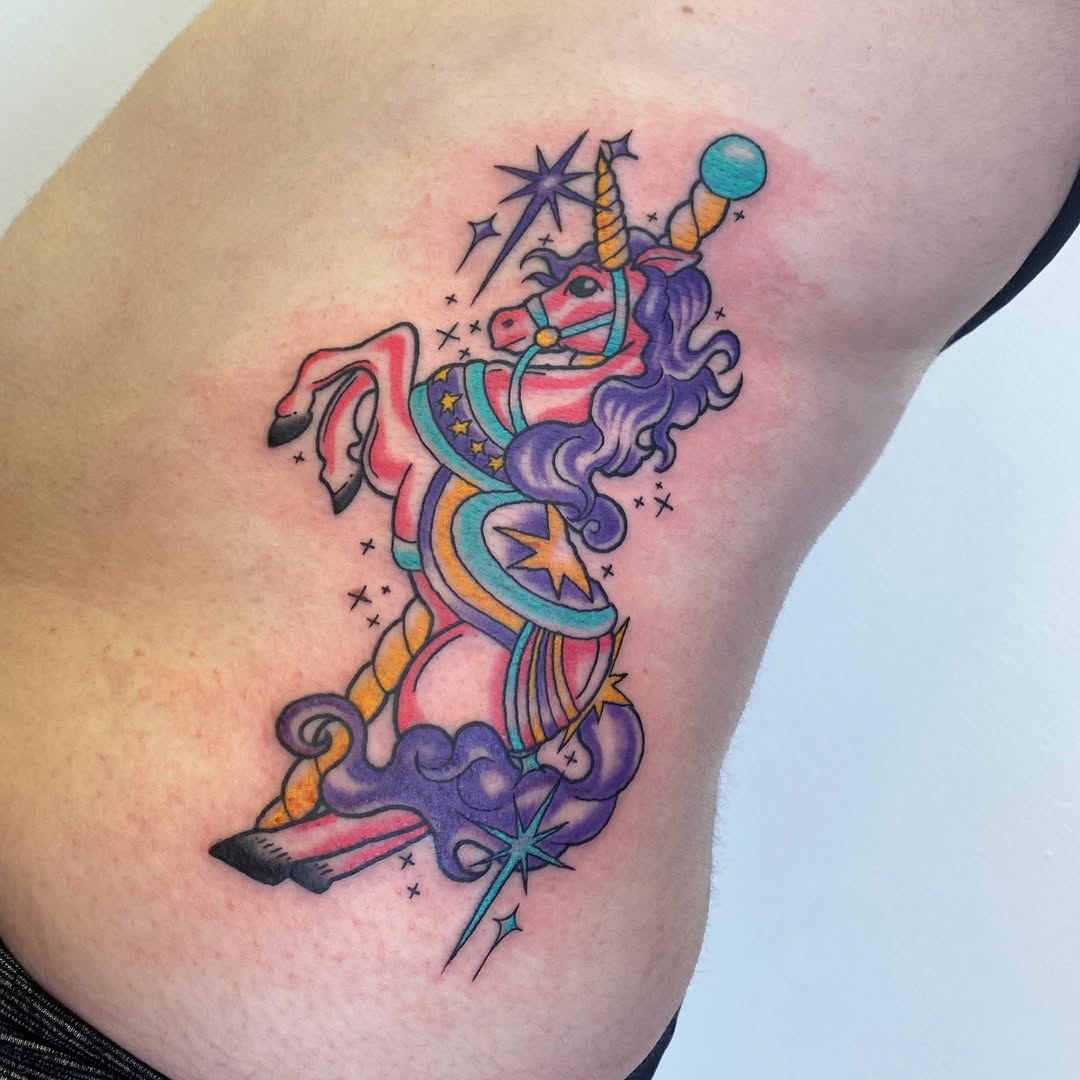 Colorful unicorn tattoo with whimsical details