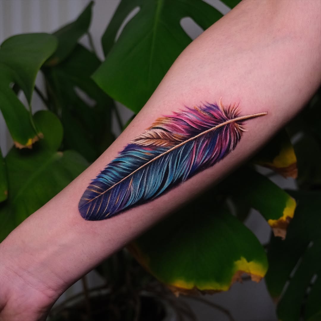 Stunning Colorful Feather Tattoo on Arm