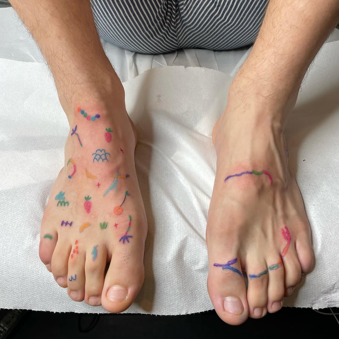 Colorful, playful foot tattoos with artistic flares