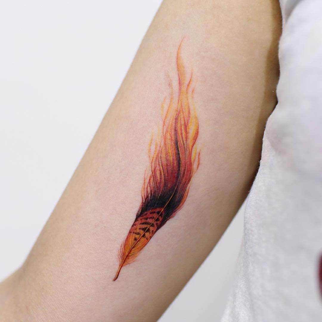 Dynamic feather tattoo with fiery gradients