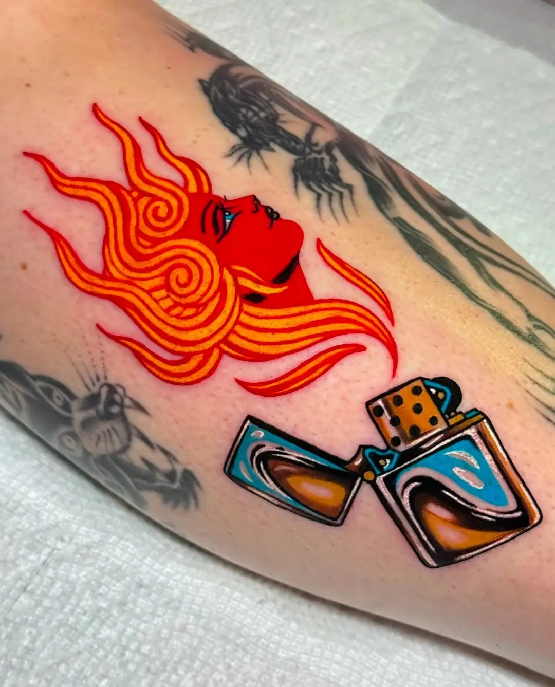 Bold fire and striking lighter tattoo design