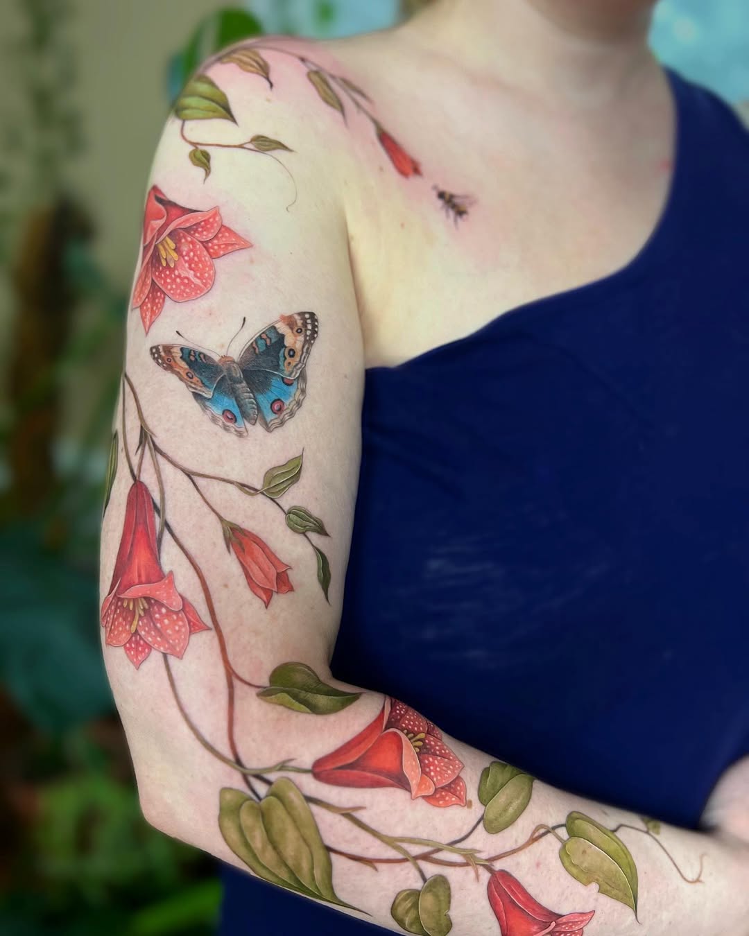 Enchanting floral tattoo with a butterfly motif