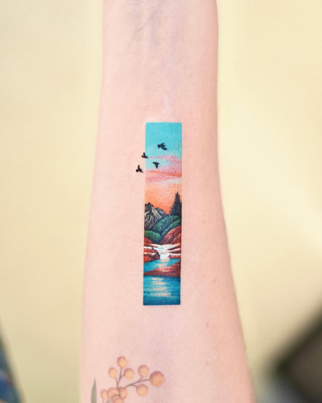 Stunning scenic mountain tattoo with birds flying