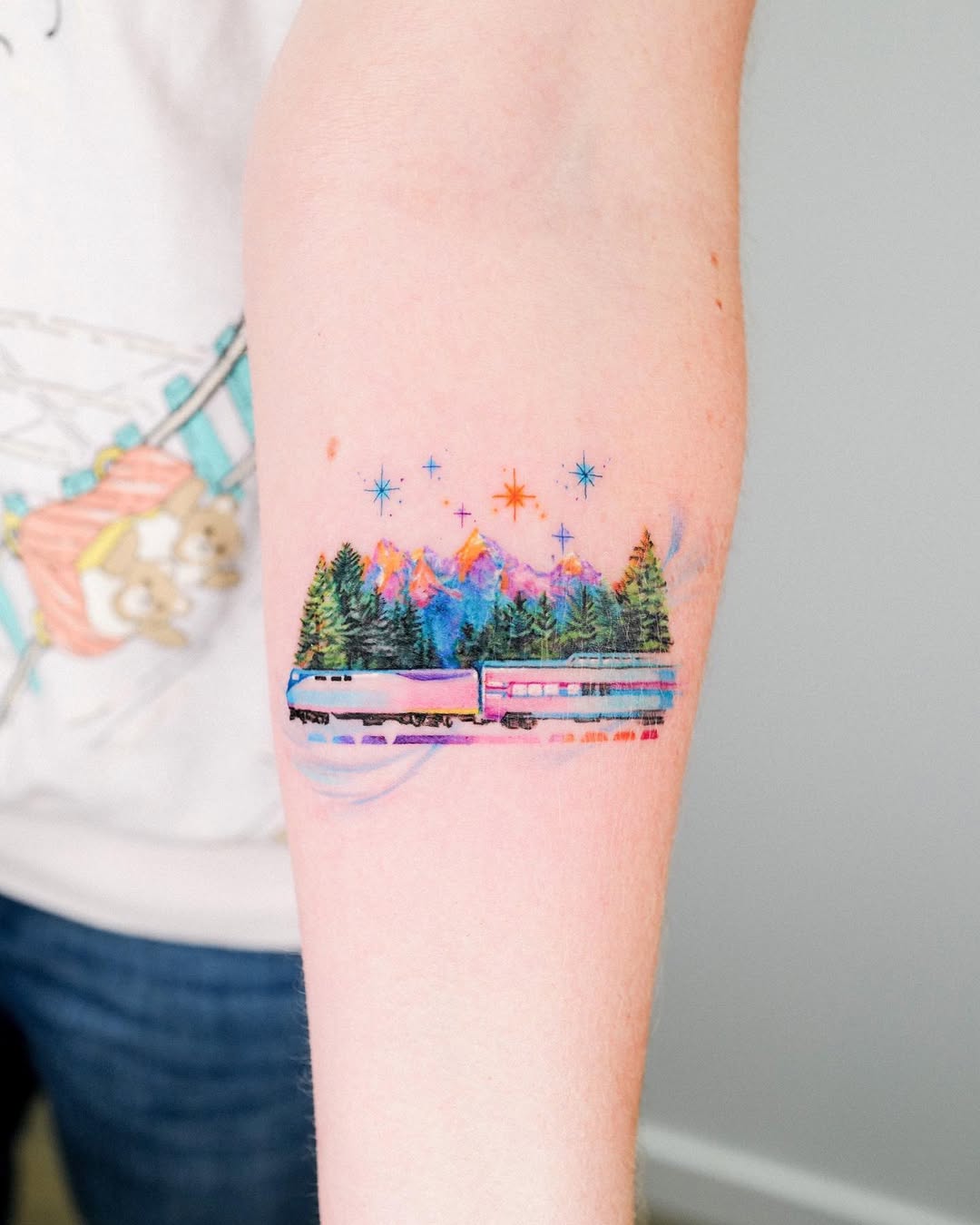 Colorful mountain tattoo illustrating nature's beauty.