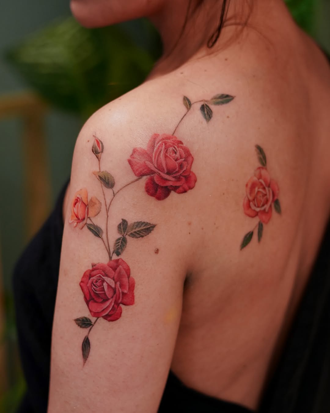 Beautiful roses in vibrant shades on skin