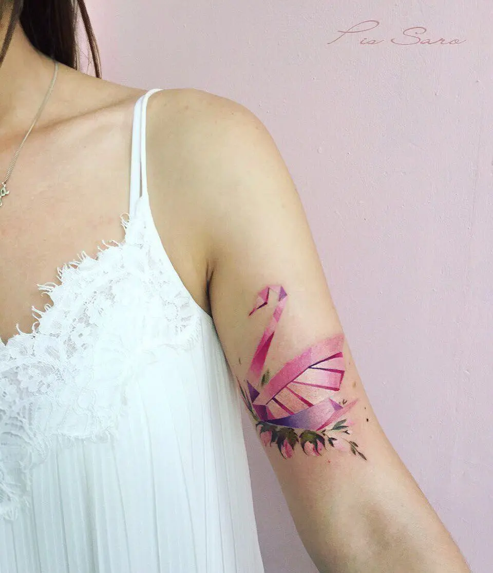 Elegantly colored swan tattoo with floral accent