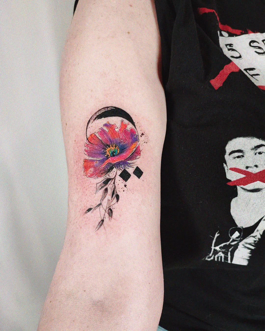 Vibrant watercolor flower with moon accents