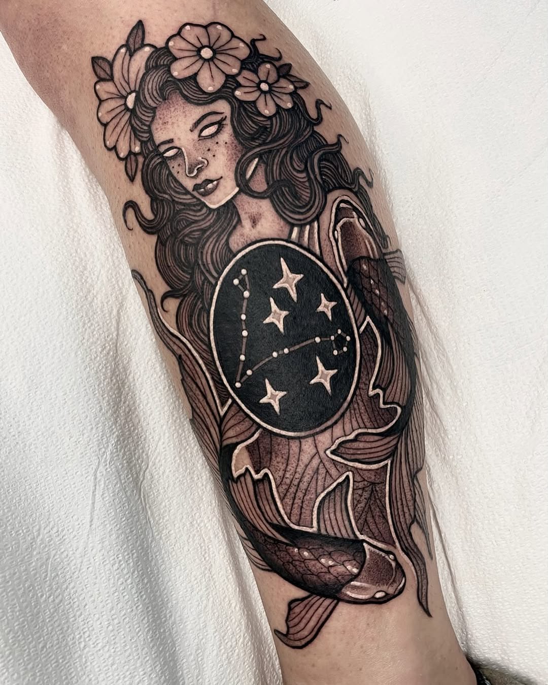 Artistic Virgo tattoo with celestial elements