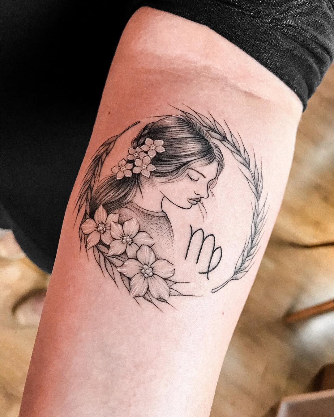 Elegant Virgo tattoo with floral accents