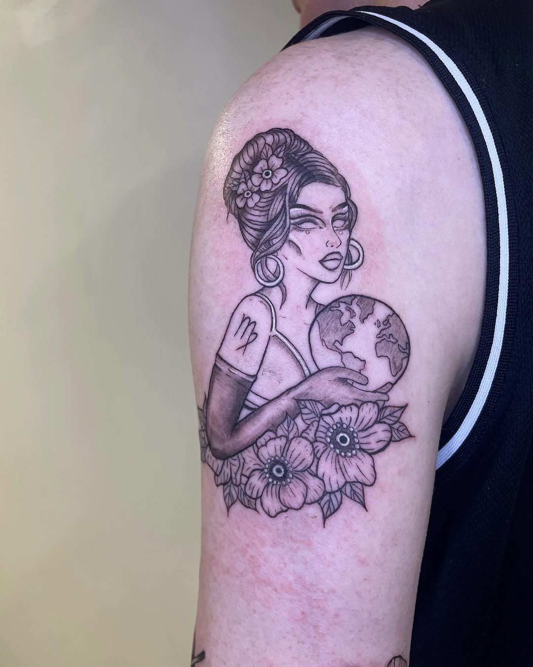 Charming Virgo tattoo with a floral touch