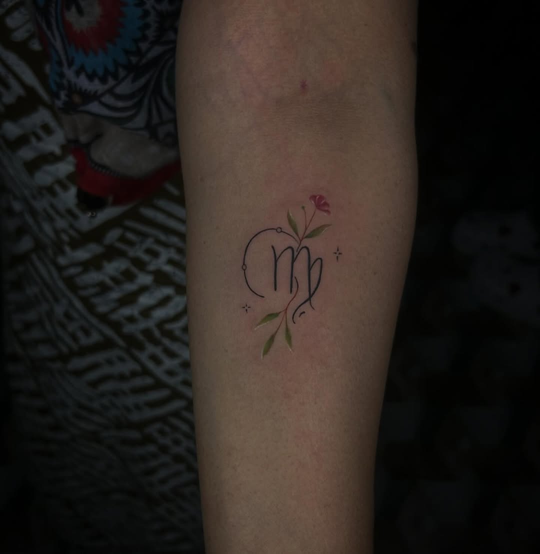 Elegant Virgo tattoo with floral accents