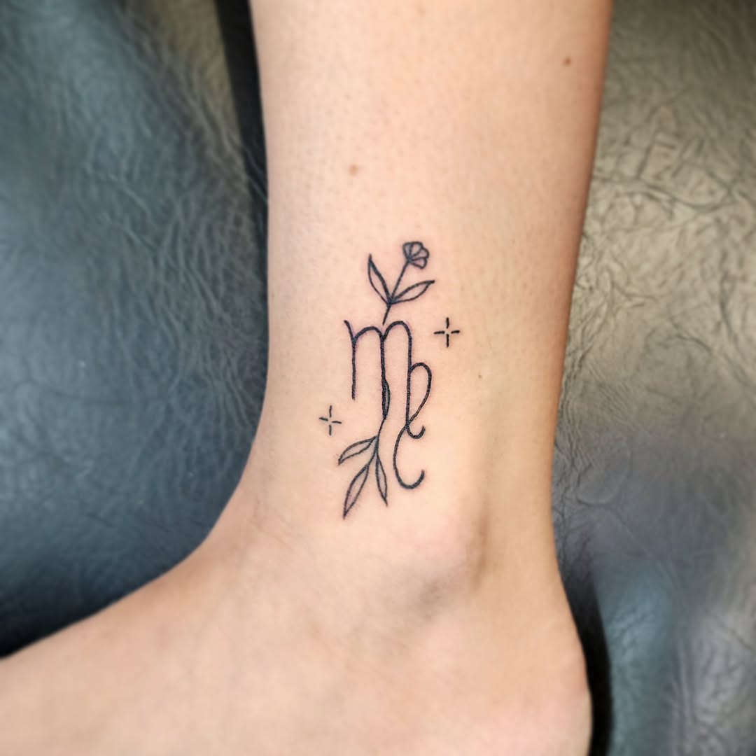 Elegant Virgo tattoo with floral elements