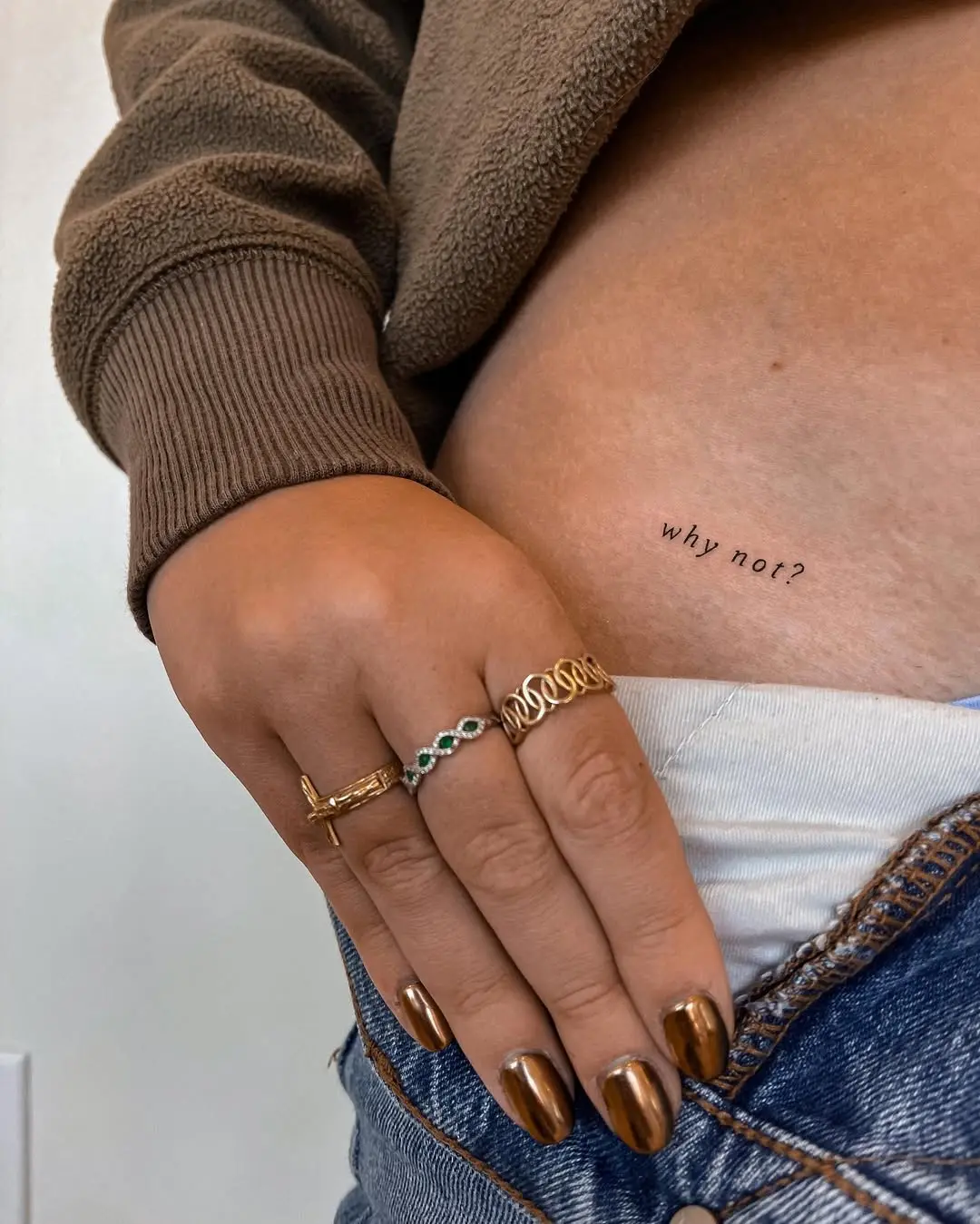 Charming waist tattoo with a motivational phrase